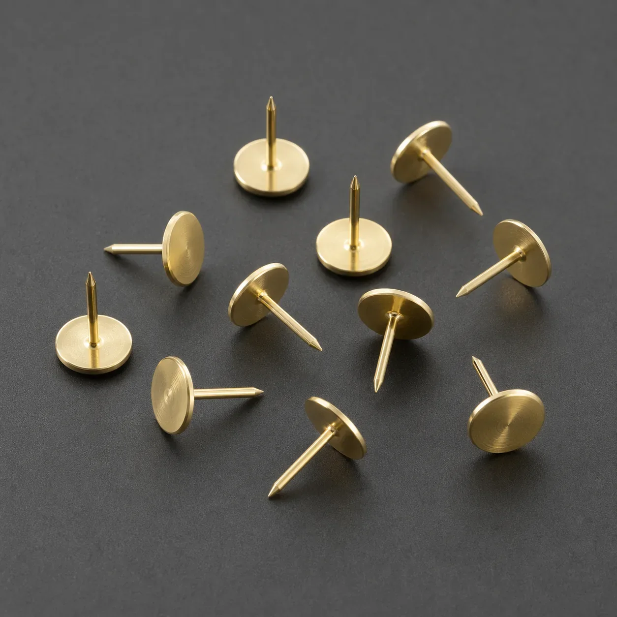 Brass garment template positioning pins in assorted working orientations