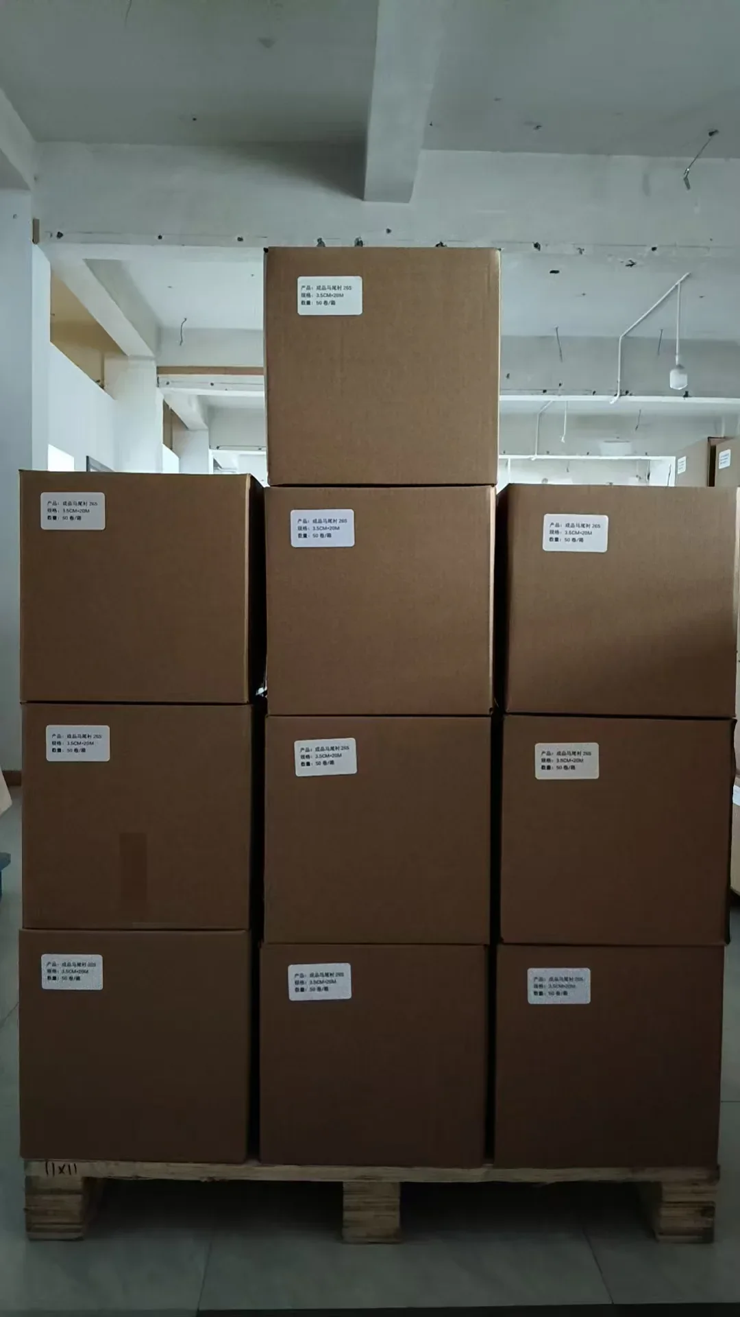 Cartons of pre-cut horsehair interlining 26S (3.5cm x 20m, 50 rolls/carton) palletized in our warehouse