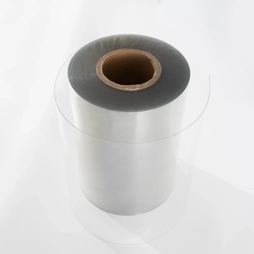 Close view of clear PET rigid film roll stock before conversion into shirt collar bands and butterfly supports