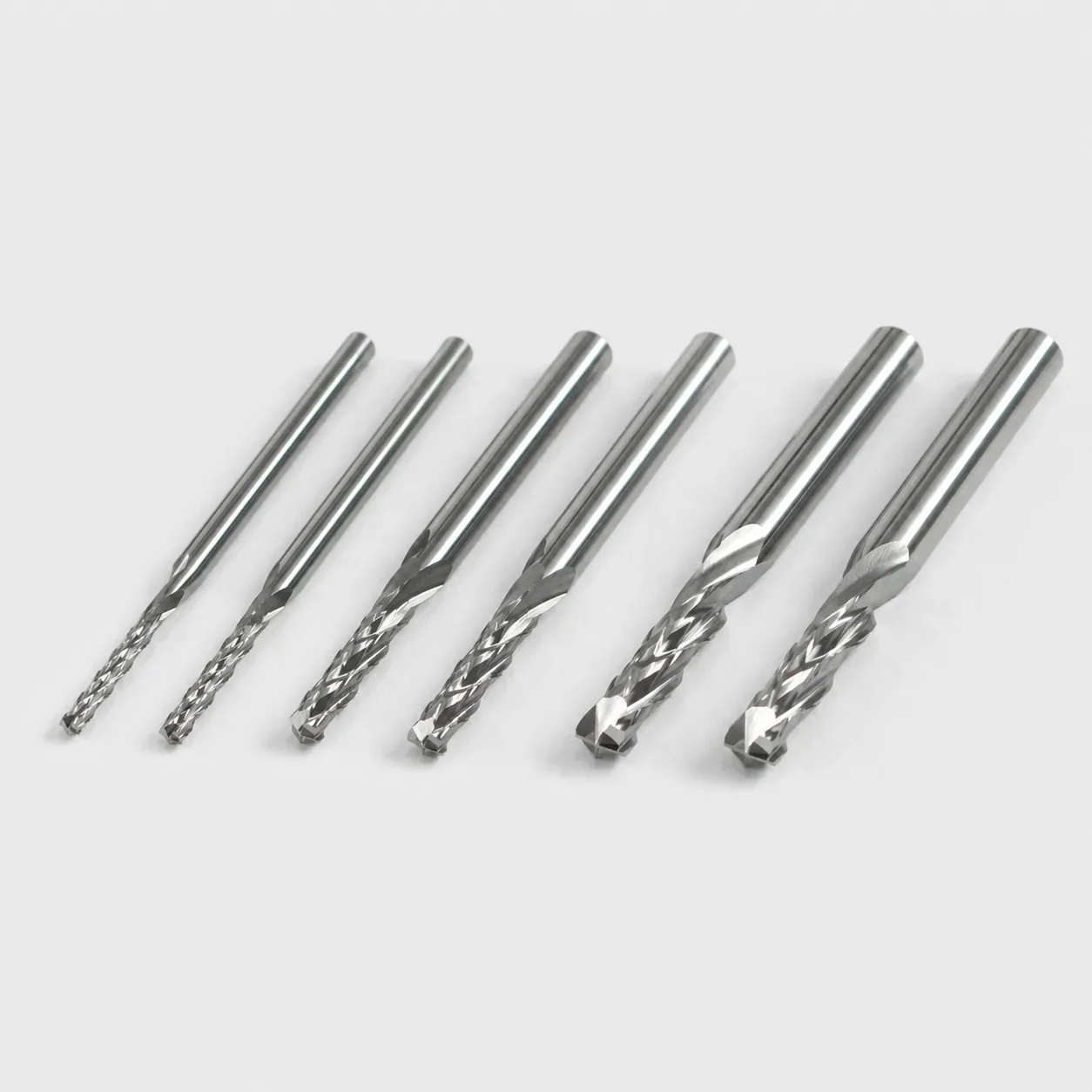 Assorted unbranded router bits for cutting PVC and epoxy garment template board